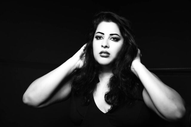 black and white glamour portrait of a dark haired woman